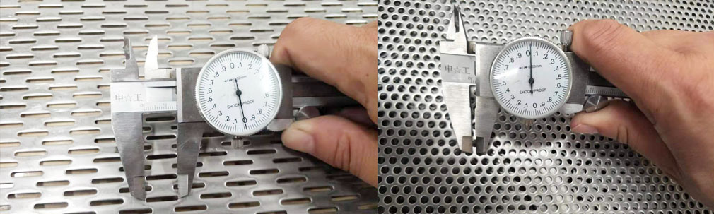 A worker is observing the condition of perforated metal sheet produced by the punching machine.