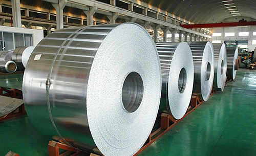 Labeled steel coils are placed in the warehouse.